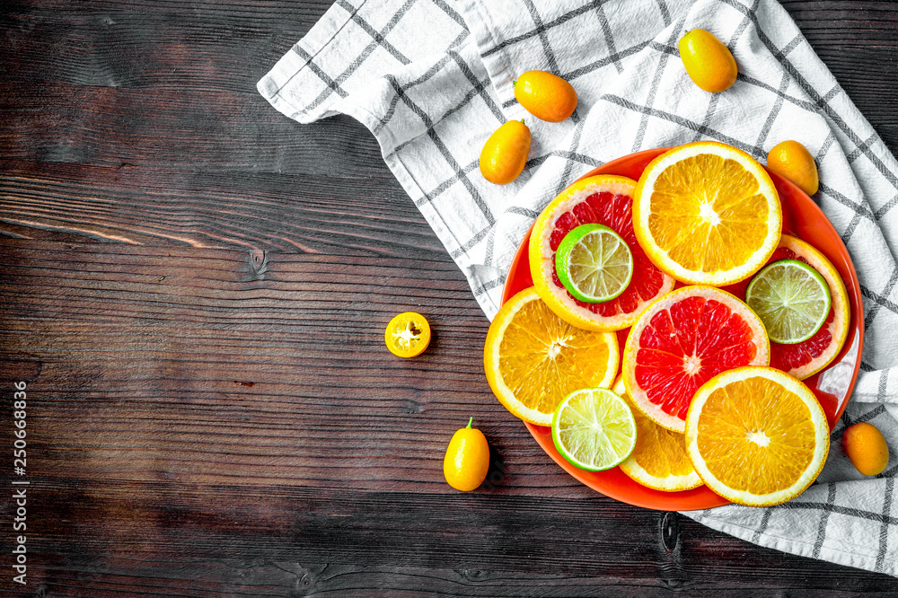 sliced citrus fruits on kitchen background top view mockup