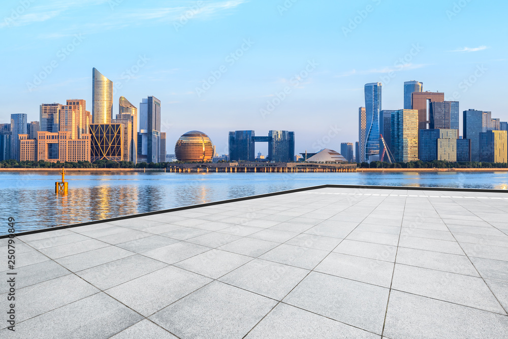 Empty square floor and Hangzhou city skyline with buildings