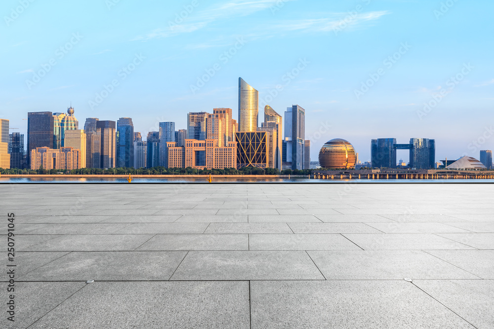 Empty square floor and Hangzhou city skyline with buildings