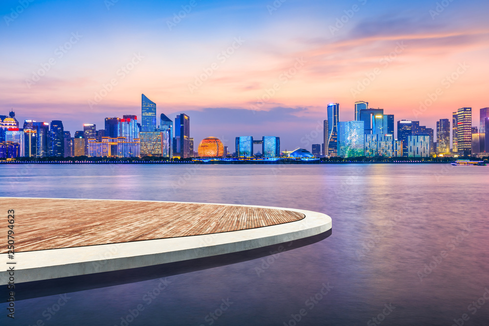 Empty wooden platform and beautiful city night view in Hangzhou