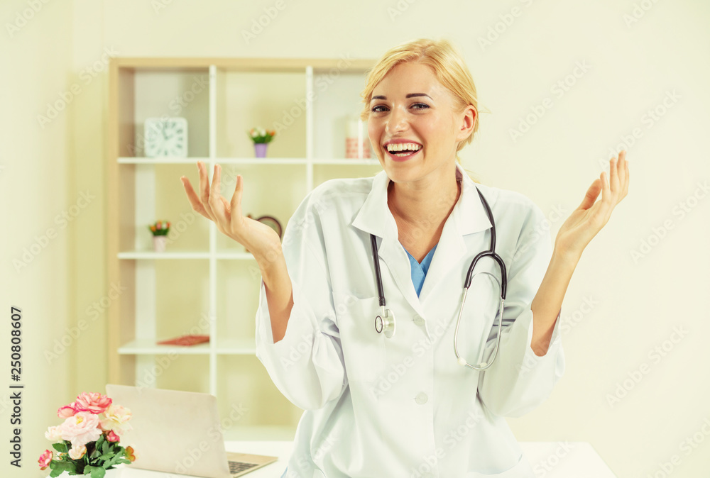 Young female doctor working in hospital office.