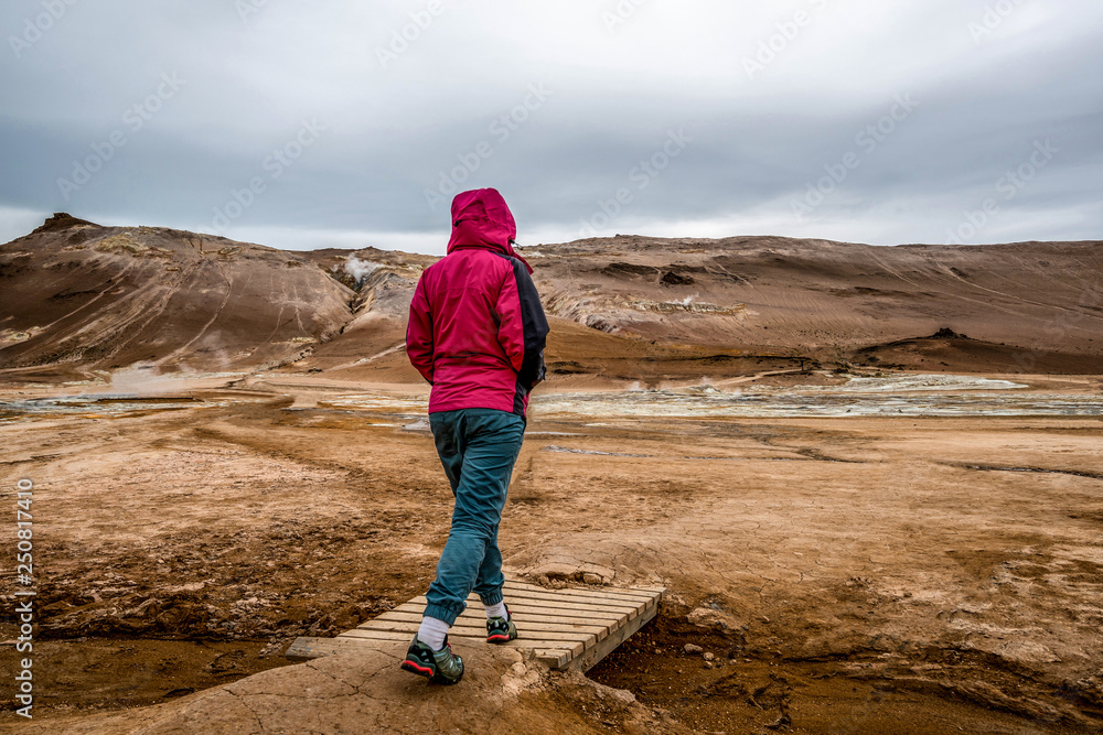 Woman traveler at Hverir, Namafjall in Iceland