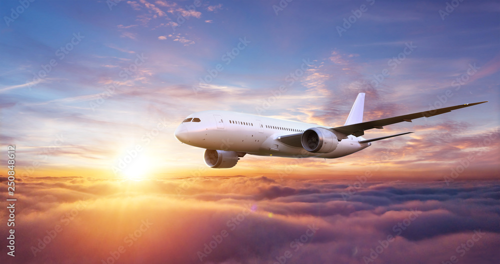 Passengers commercial airplane flying above clouds