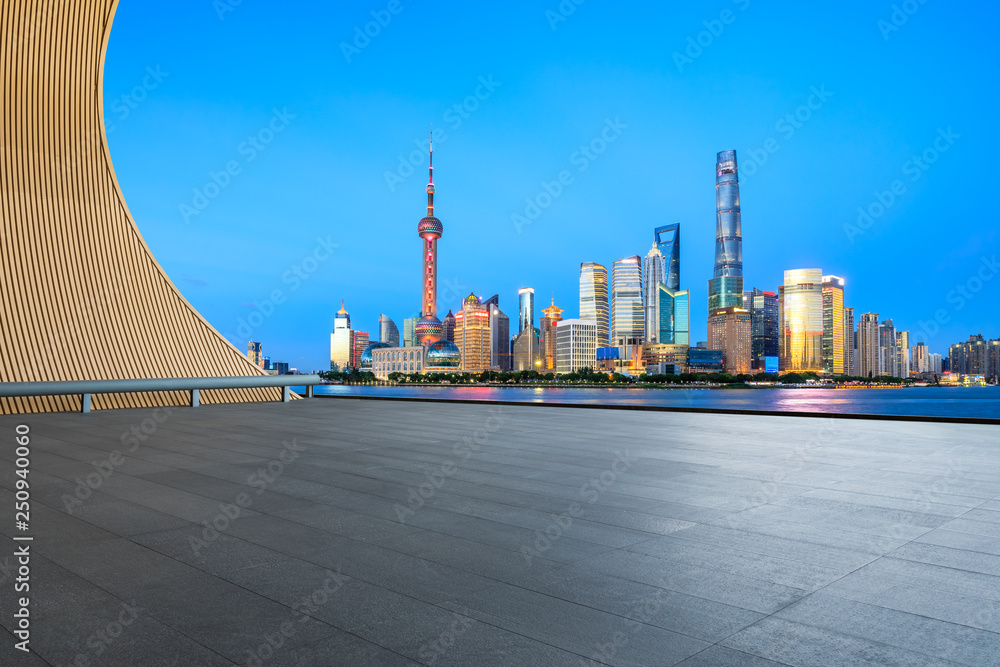 Empty square floor with panoramic city skyline in shanghai at night,China