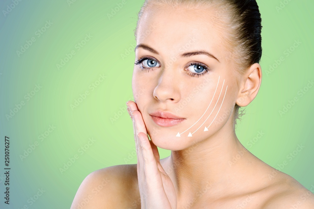 Close up portrait of beautiful young woman face . Isolated on  background. Skin care or spa concept,