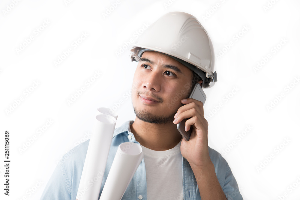 Portrait of asian engineer holding blueprint and using a cellphone isolated on white background