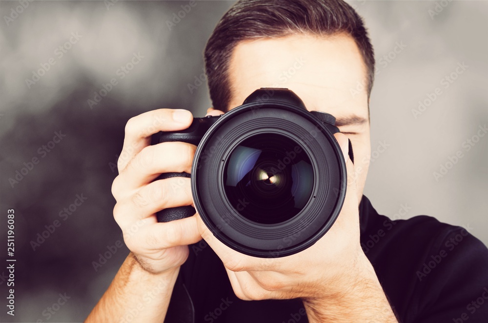 Male Photographer with Camera on  background