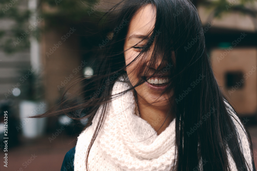 Portrait of a smiling woman standing outdoors