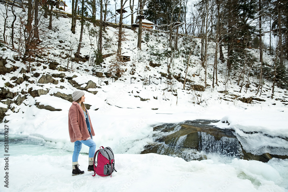 Beautiful woman at snowy resort