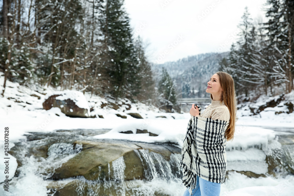 Beautiful woman at snowy resort