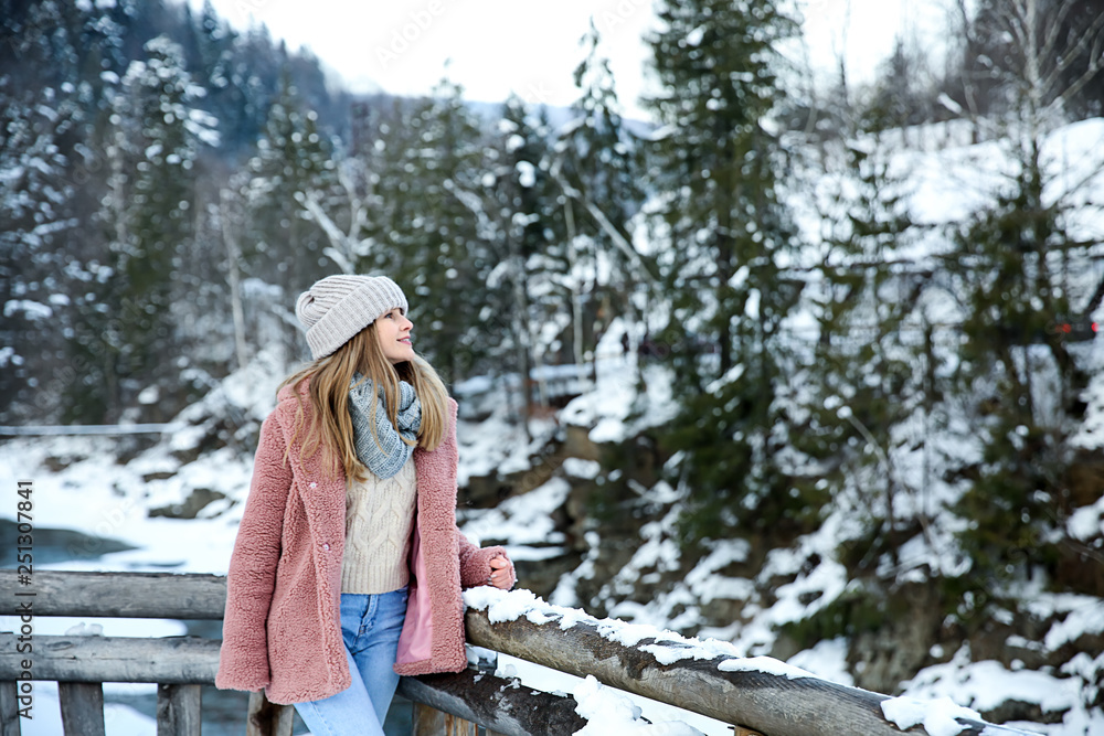 Beautiful woman at snowy resort