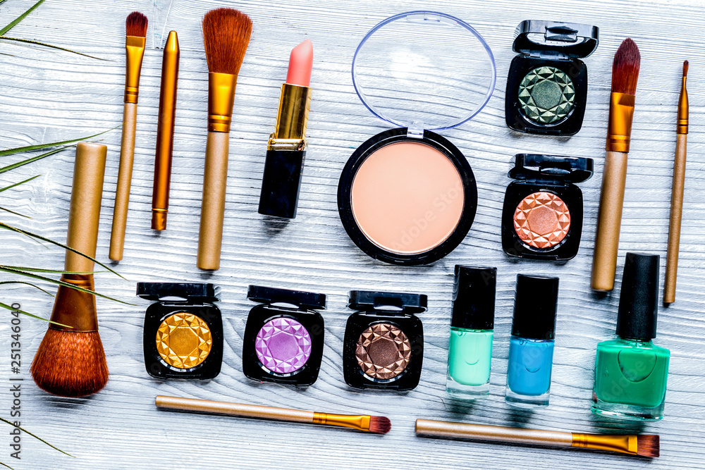 Beauty and fashion concept with decorative cosmetics on table background top view