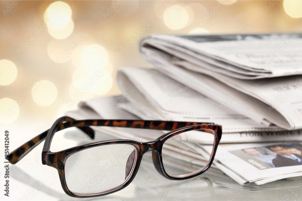 Pile of newspapers on white background