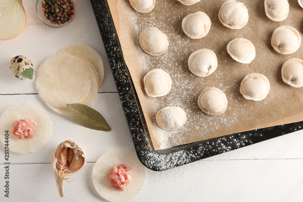 Raw fresh dumplings on kitchen table