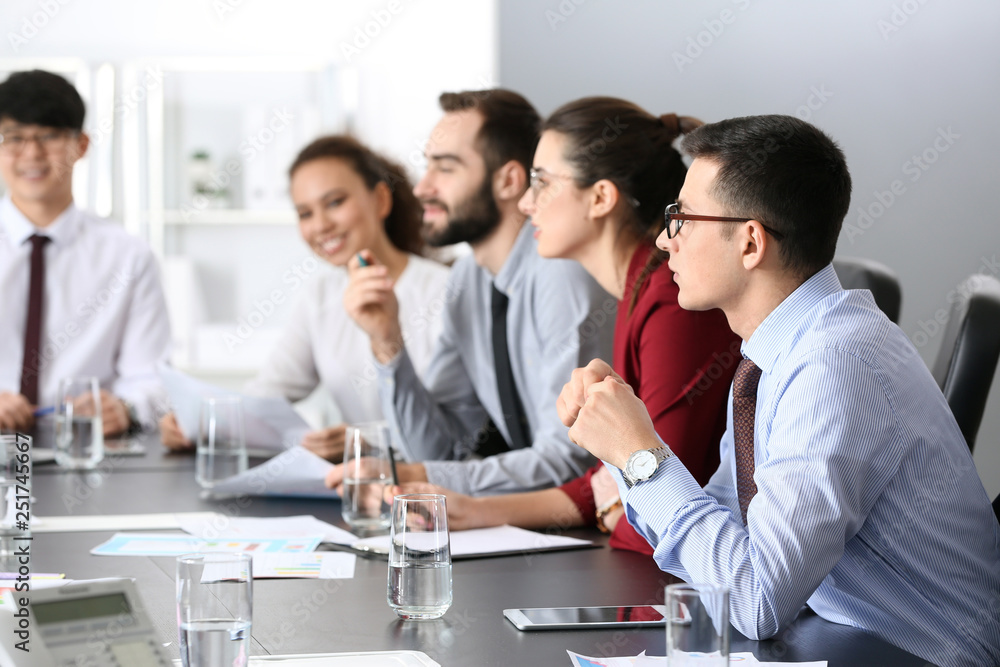 Young people having business meeting in office