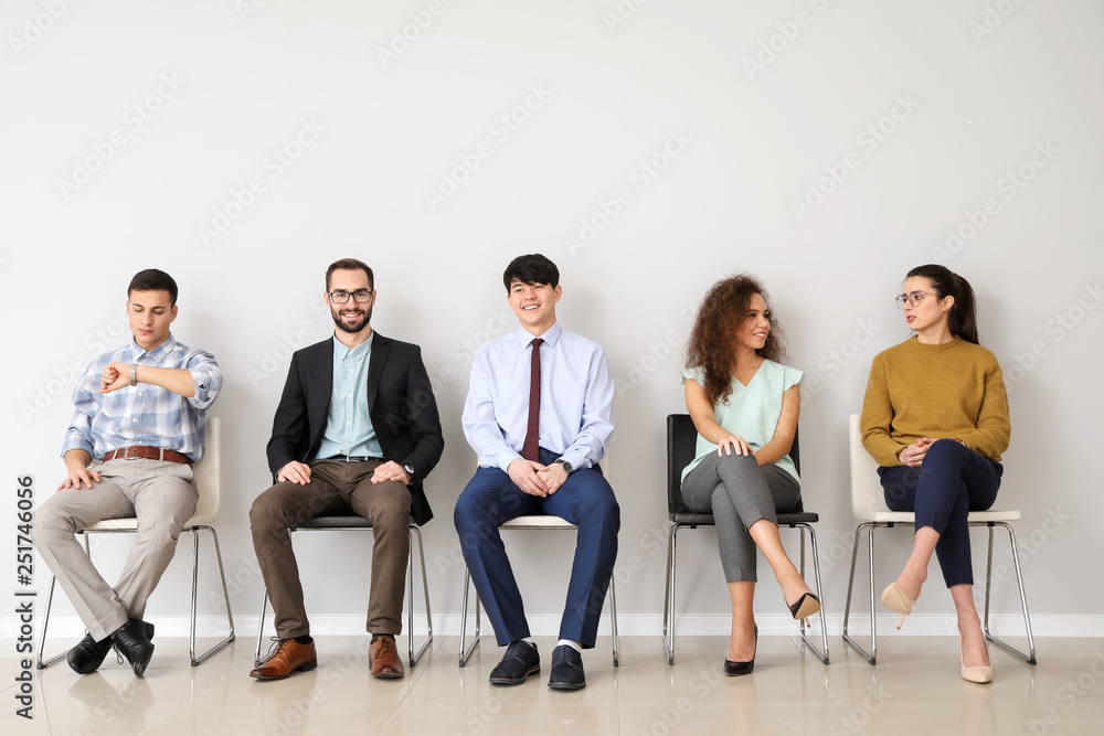 Young people waiting for job interview indoors