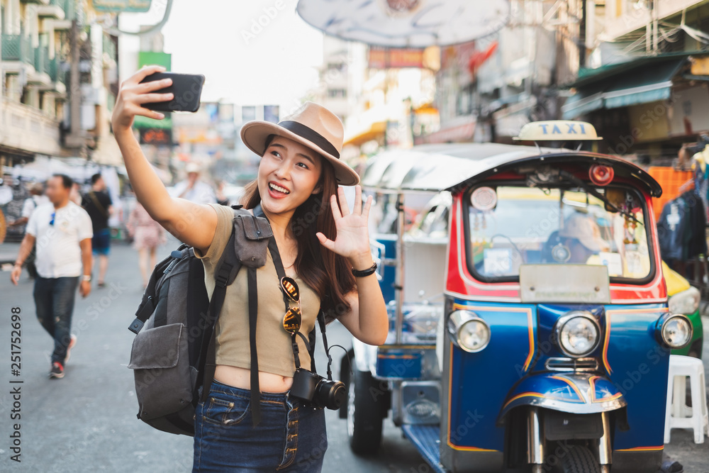 Asian woman tourist backpacker travel in Khao San road, Bangkok, Thailand