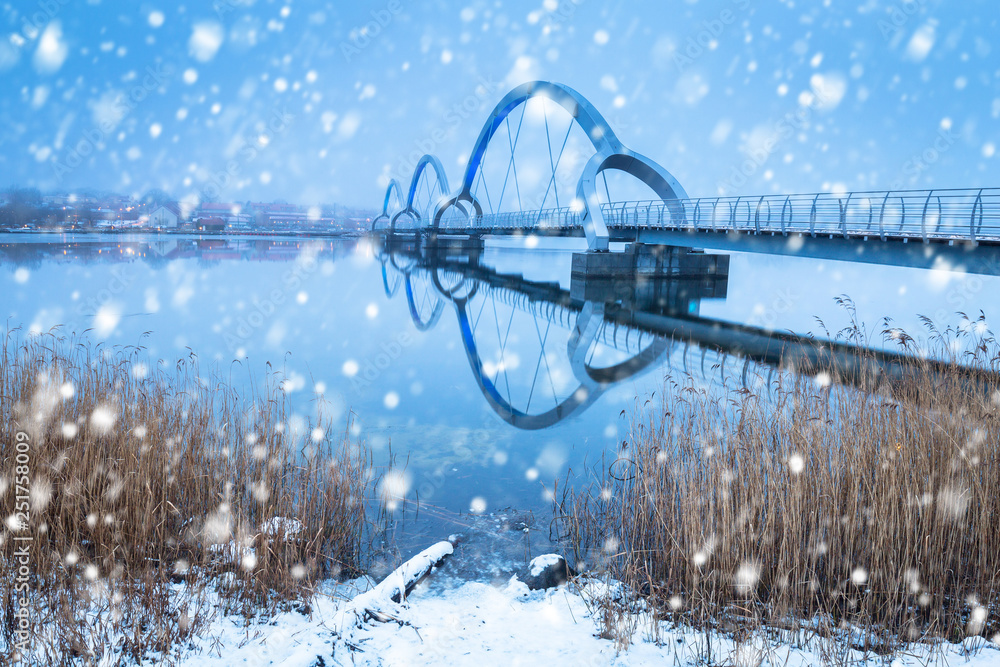 Solvesborgsbron pedestrian bridge with falling snow in the south of Sweden