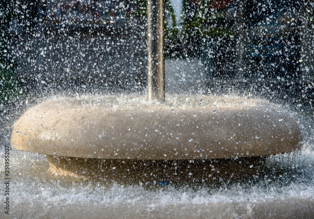 Water splashes in the fountain shot close-up 