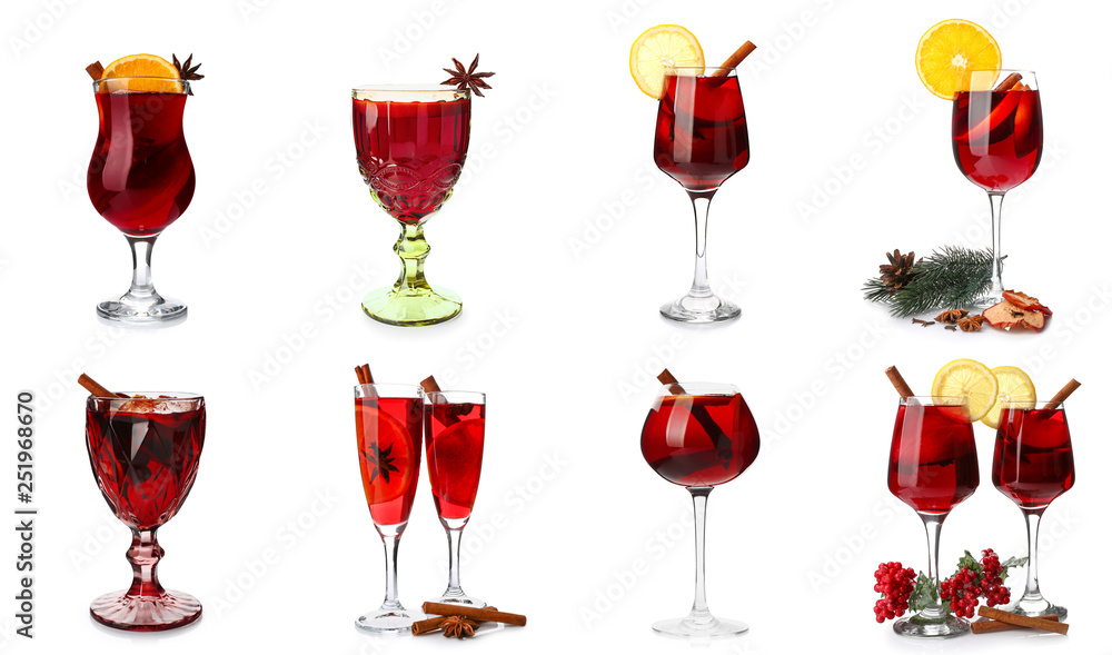 Set of glasses with tasty mulled wine on white background