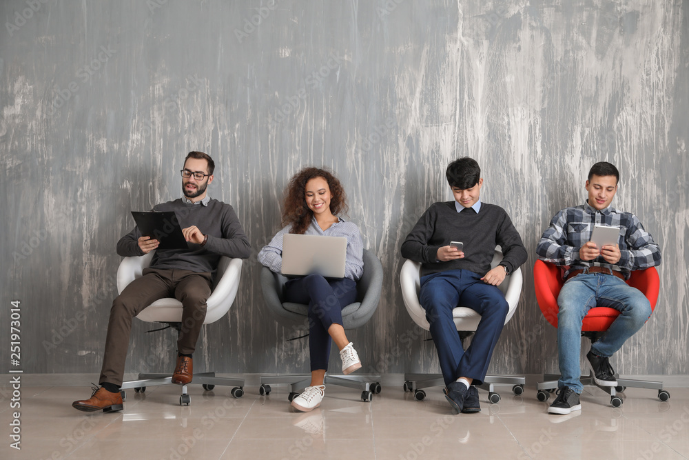 Young people waiting for job interview indoors