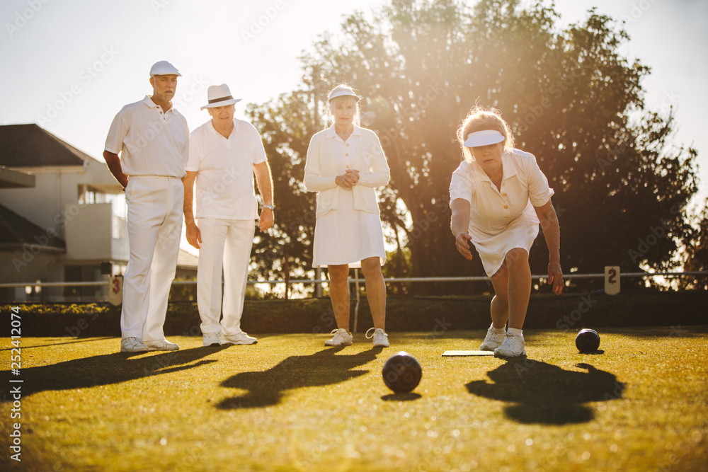 Group of senior friends playing boules