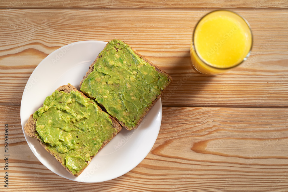 Toasts with avocado guacamole. Diet breakfast. Delicious and healthy plant-based food.