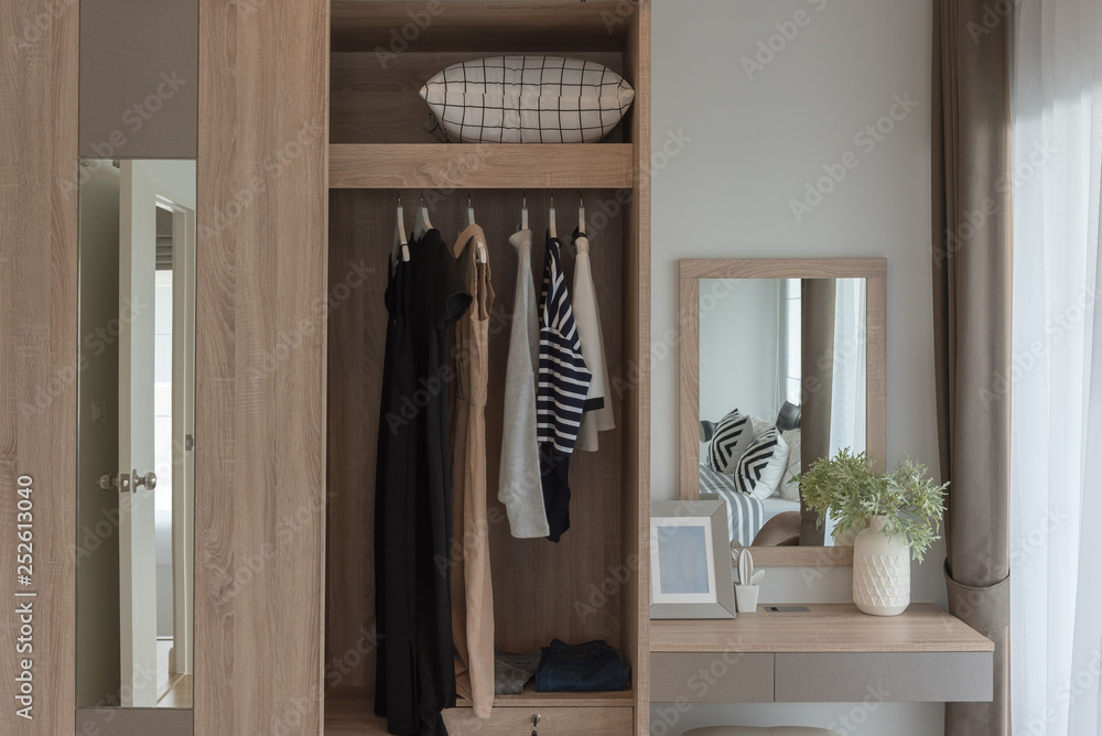 modern closet with clothes