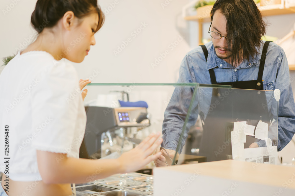 customer select and choose some food order to waiter at bar