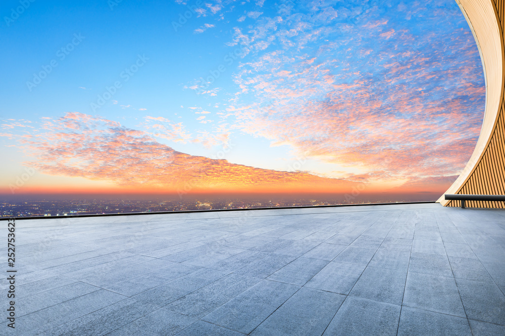 Empty square floor and modern city skyline with beautiful colorful clouds at sunset