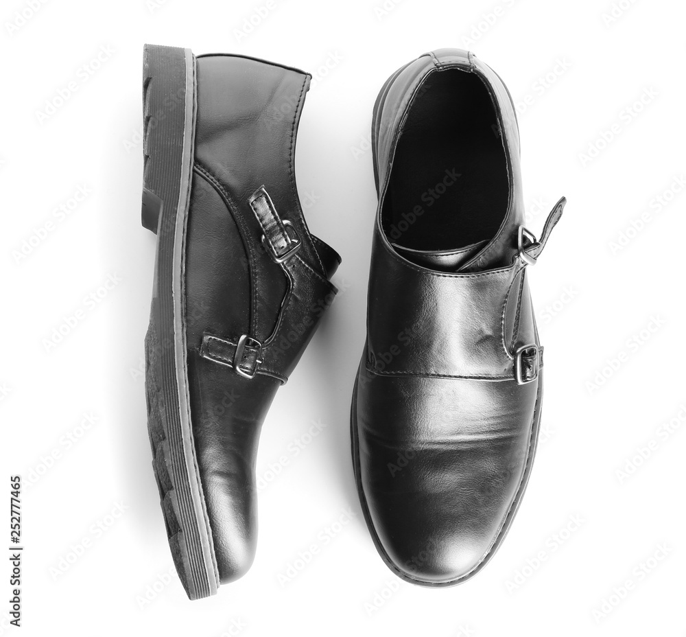 Pair of stylish male shoes on white background