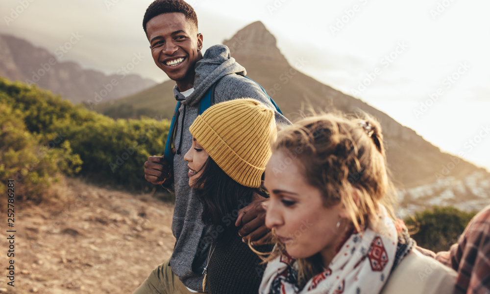 African man with friends on hiking trip