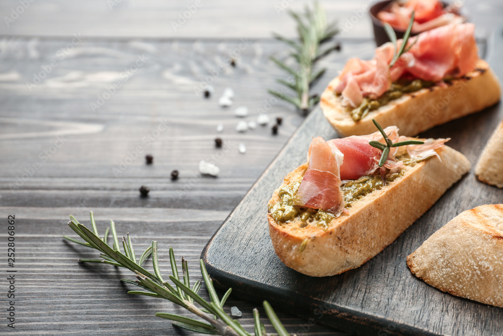 Fresh tasty bruschettas on wooden table