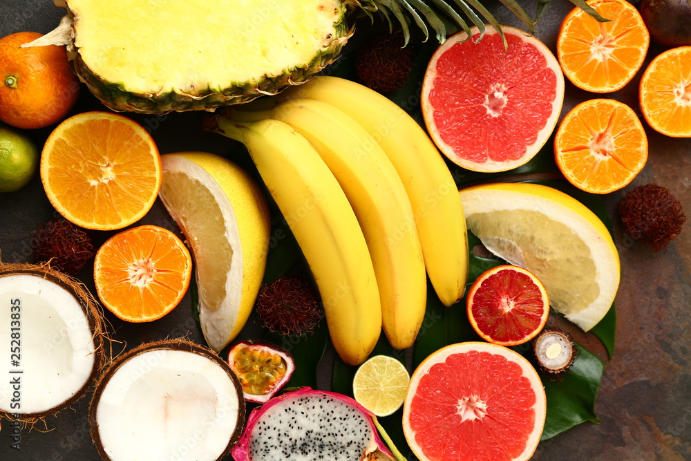 Assortment of exotic fruits on grey table