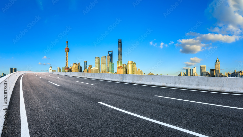 Asphalt road passes through Shanghai Lujiazui Financial District