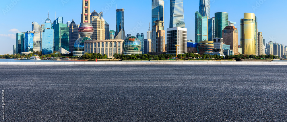 Asphalt road passes through Shanghai Lujiazui Financial District