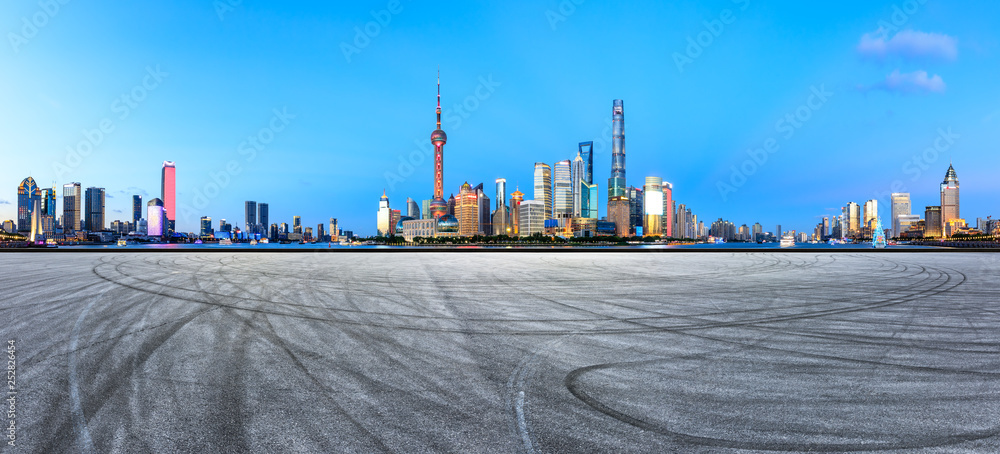 Empty asphalt square ground with panoramic city skyline in Shanghai,China