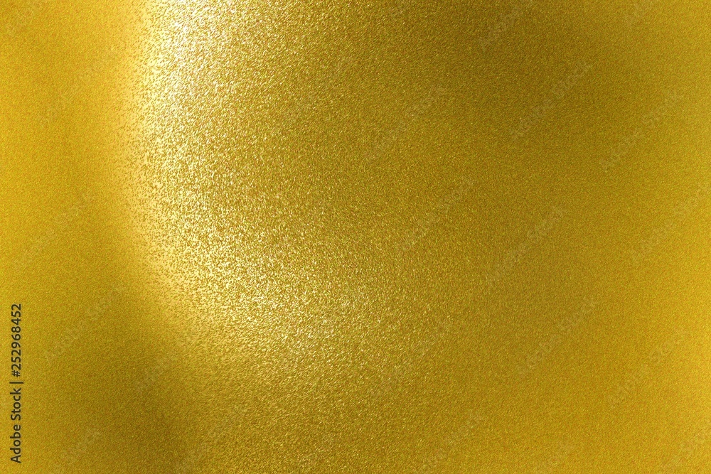 Shiny rough gold metal wall, abstract texture background