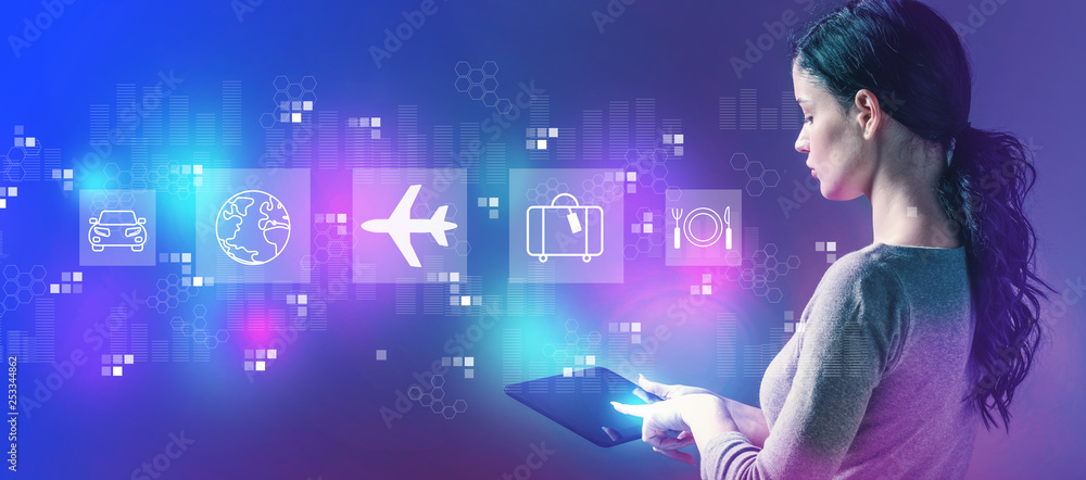 Airplane travel theme with business woman using a tablet computer