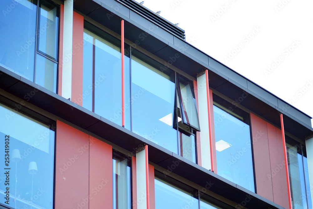 Sky reflected in a modern building glass facade