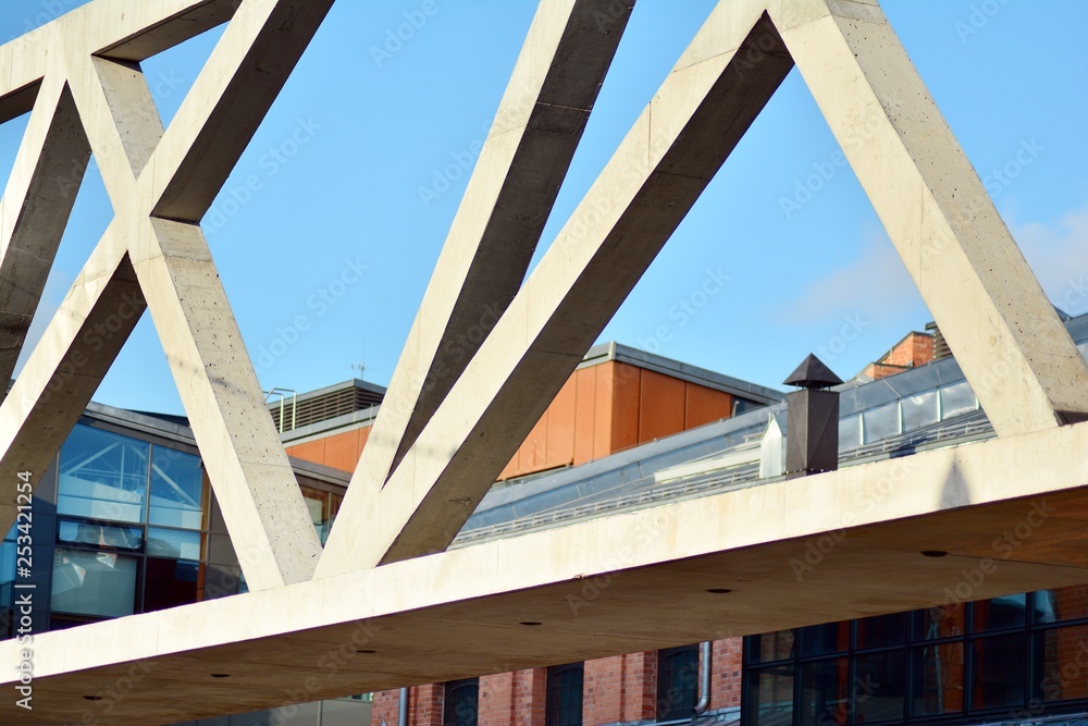 Abstract image of looking up at modern glass and concrete building. Architectural exterior detail of