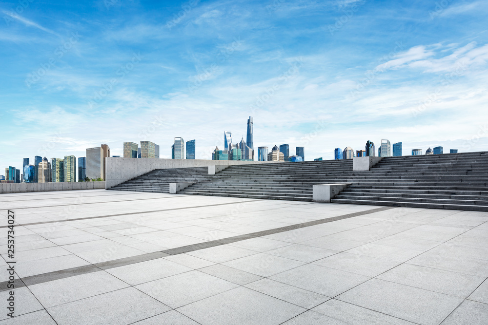 Empty square floor and panoramic city skyline with buildings in Shanghai