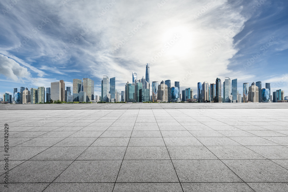 Empty square floor and panoramic city skyline with buildings in Shanghai