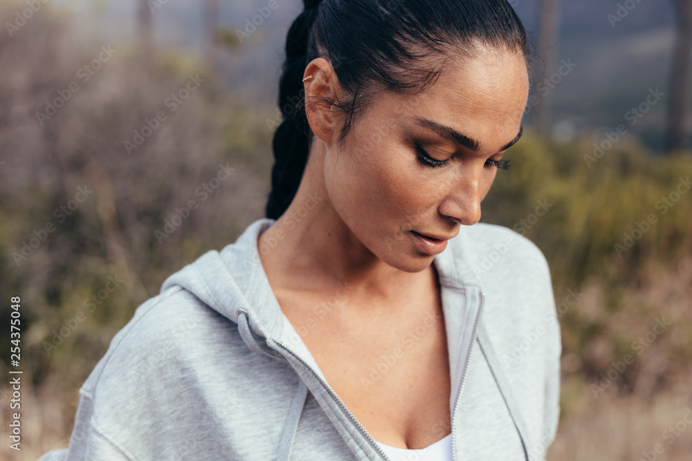 Female taking a break after running workout