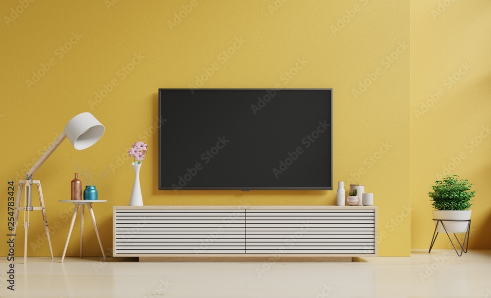 Smart TV on the yellow wall in living room and Floor lamp,minimal design,3d rendering 