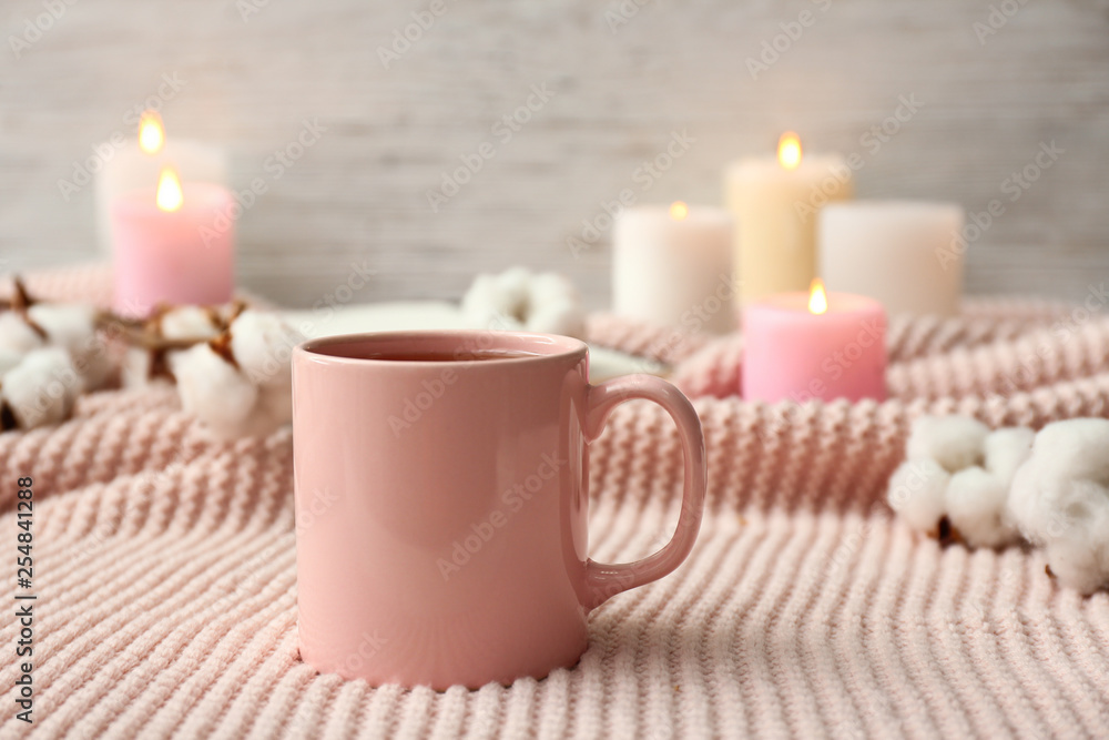 Cup of hot tea on table