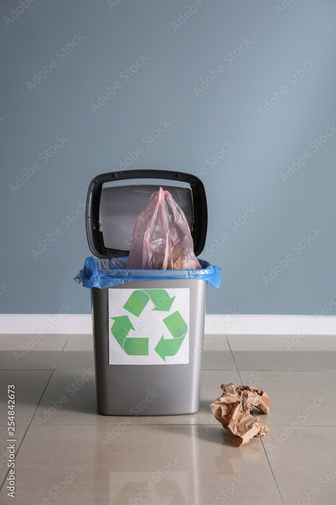 Trash bin with garbage indoors. Recycling concept