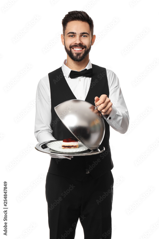 Handsome waiter with tasty dessert on white background