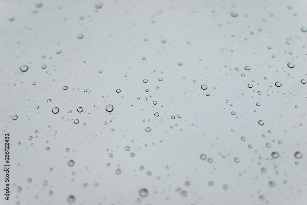 Water drops on clean bright window focused detail