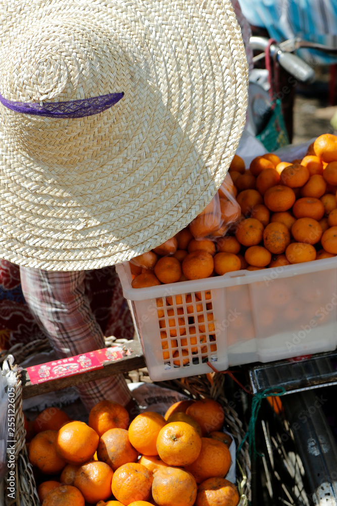 asian street seller sell orange